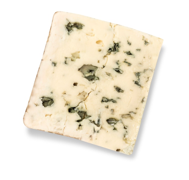 A wedge of full fat soft blue cheese isolated on white