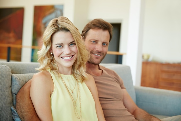 Weekend in with my love Portrait of a happy couple relaxing on the sofa together at home