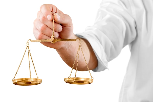 Weight scales in hand on white background