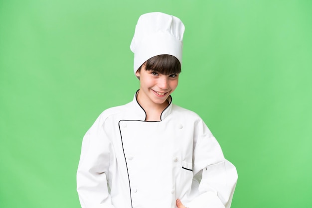 Foto weinig kaukasisch chef-kokmeisje over geïsoleerde lachende achtergrond