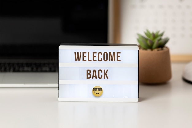 Welcome back message with sign
