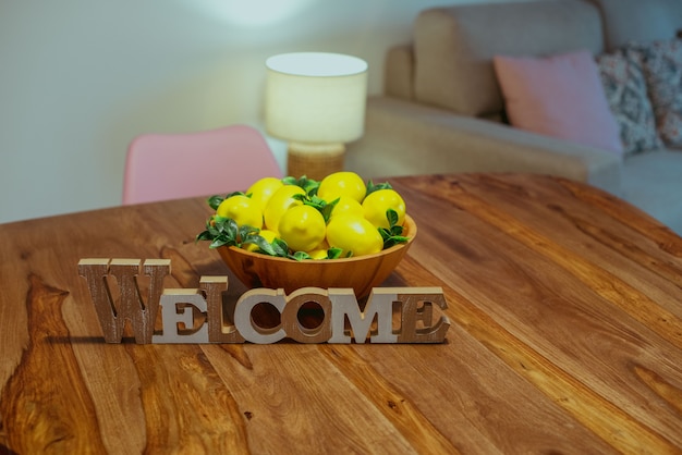 Welcome letters on the table next to lemons