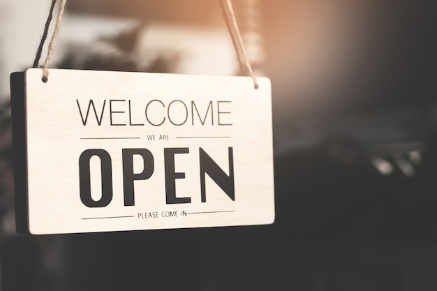 Welcome open sign on shop door