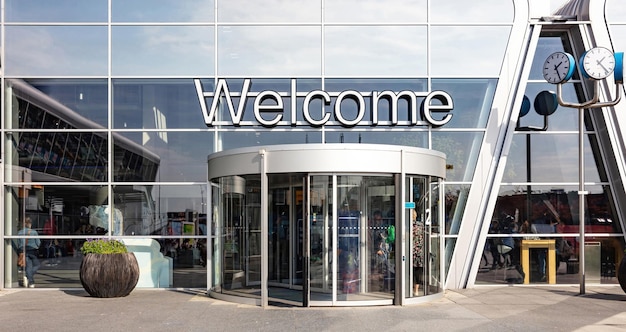 Welcome sign big letters text at Eindhoven airport terminal entrance Holland