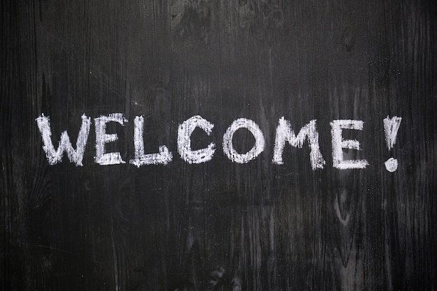 Welcome sign handwritten on blackboard