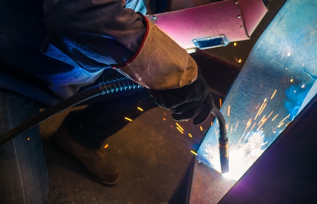 Welder and bright sparks. Production and construction