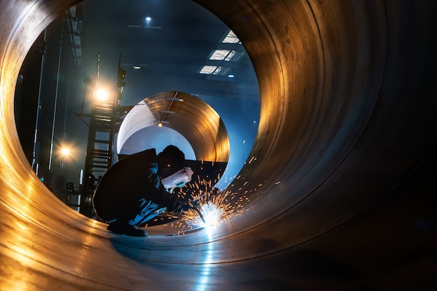 The welder is welding steel plates