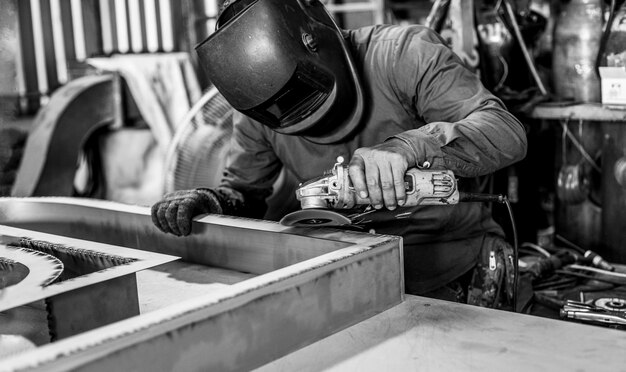 Welder working at the factory. Welding process. Welder occupation