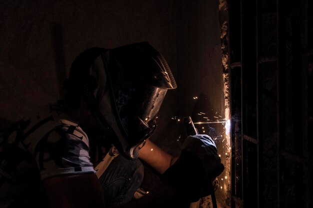 A welding in a dark room without light