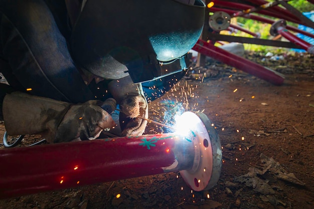 Welding male worker metal is part in fire water pipeline