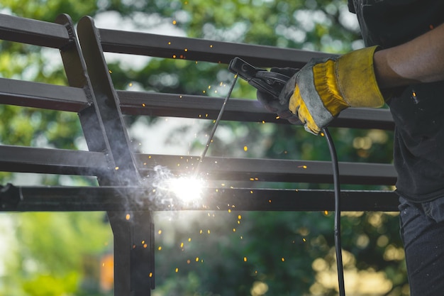 Welding metal by electric arc welding closeup