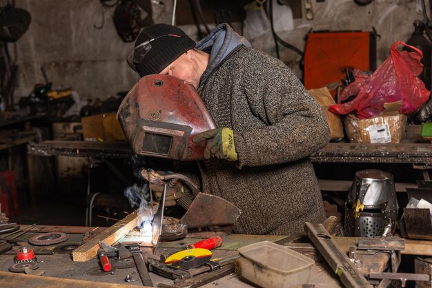 Welding process in the industrial workshop by worker