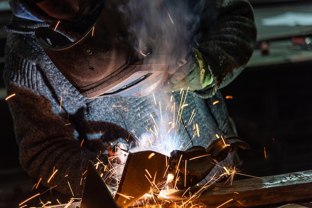 Welding process in the industrial workshop by worker