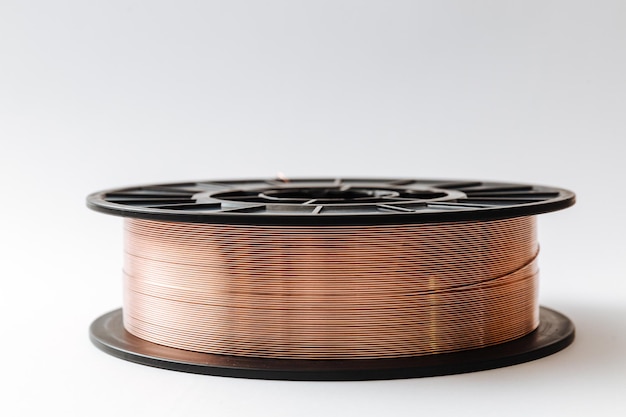 Welding wire spool on a white background