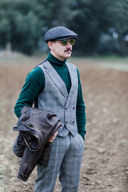 Well-dressed man wearing a grey retro suit