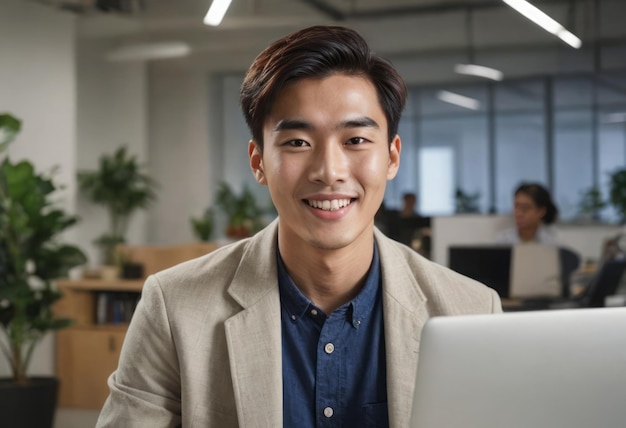 A welldressed man works on his laptop his smart casual attire and smile suggest a relaxed corporate