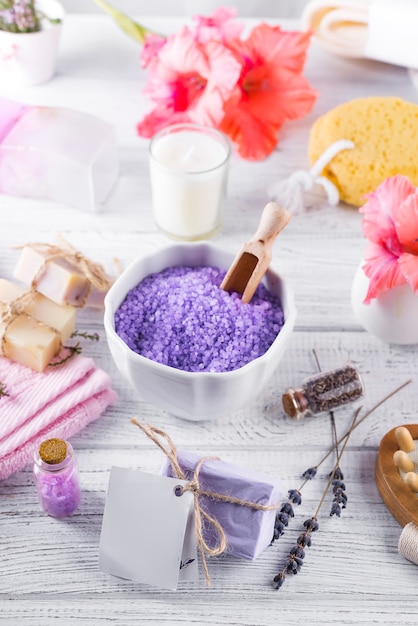 Wellness setting. Sea salt in bowl, towels,