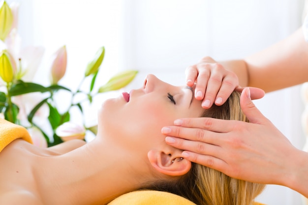 Wellness - woman getting head massage in Spa