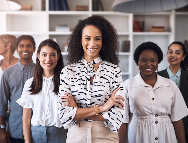 Photo were all dedicated to success portrait of a diverse group of businesspeople standing together in an office