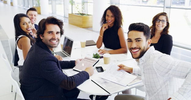 Were always looking up Cropped shot of a group of businesspeople sitting around the boardroom table during a meeting