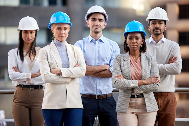 were the best planners in town. shot of a group of architects standing with their arms crossed against a city background.