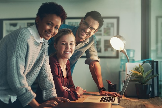 Were the best for a reason Cropped portrait of three young businesspeople looking at a laptop