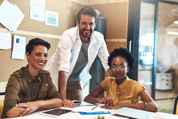 Were here to set new heights Portrait of a diverse group of businesspeople working together in an office