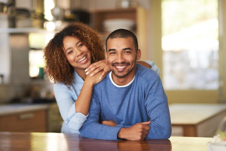 Photo were just two happy homebodies. portrait of a happy young couple in their kitchen at home.