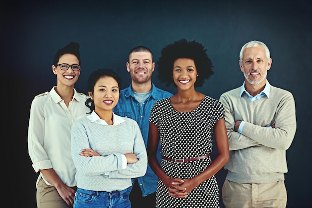 Were the team you need Portrait of a diverse team of creative colleagues posing in the studio