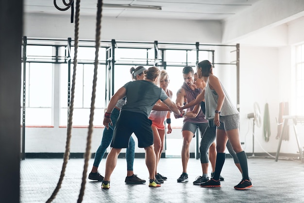 Were in this together Shot of a fitness group working out at the gym
