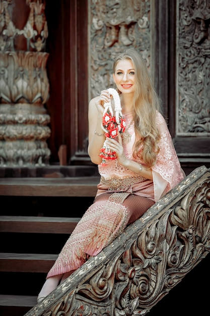 Western beautiful woman In the Thai dress