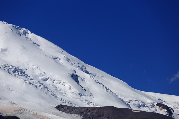 The western slope of Mount Elbrus is covered with snow. The northern side of the Caucasus Mountains in Russia.