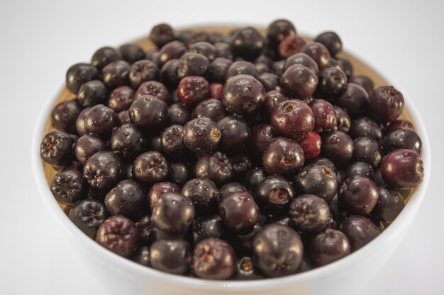 Wet aronia in white bowl