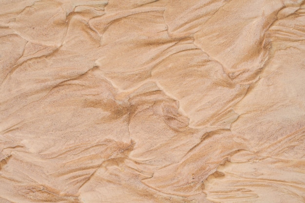 Wet brown sand nature texture background. top view