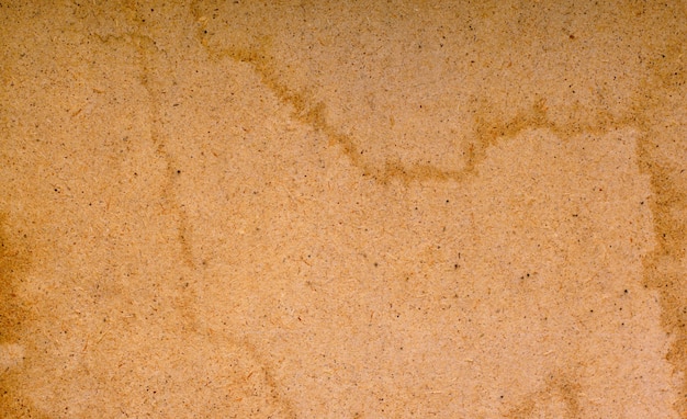Wet cardboard texture, orange color and stains of water