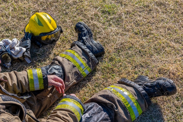 Wet firefighters resting during rescue tasks