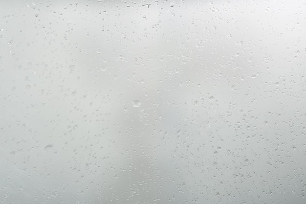 wet glass background condensate / abstract rain, drops texture on transparent glass