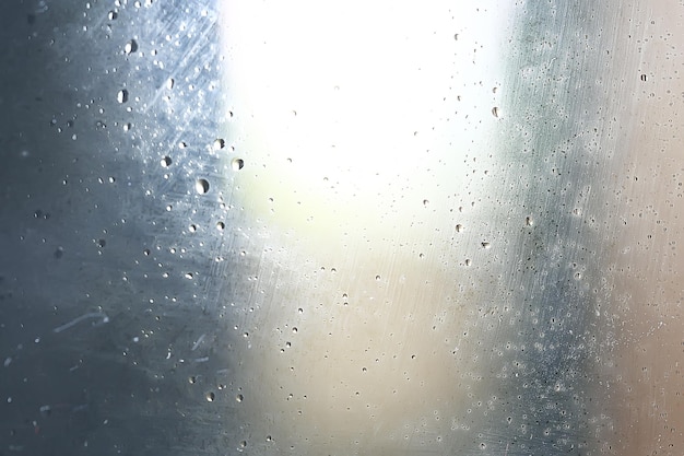 濡れたガラスの背景の凝縮/抽象的な雨、透明なガラスにテクスチャをドロップします