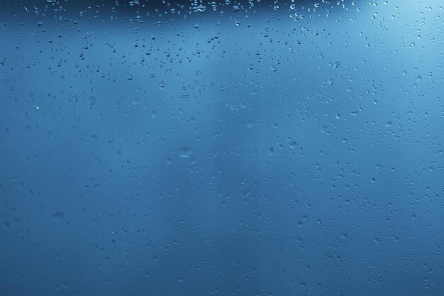 Wet glass background condensate / abstract rain, drops texture\
on transparent glass