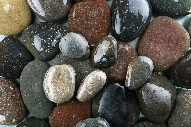 Wet sea pebbles background