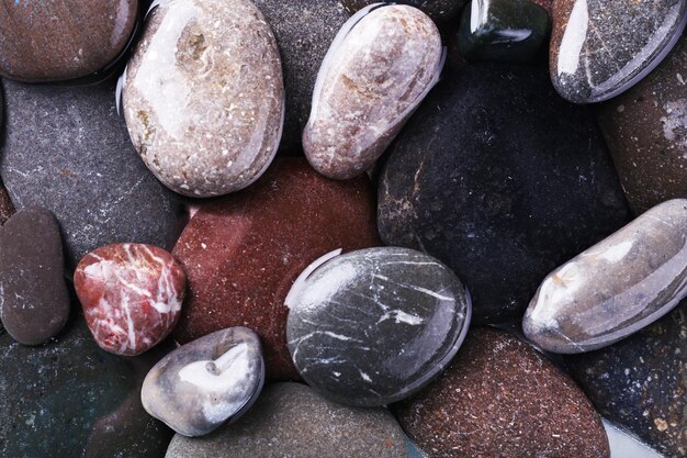 Wet sea pebbles background