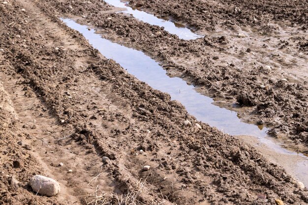 Wet soil mud on an agricultural field