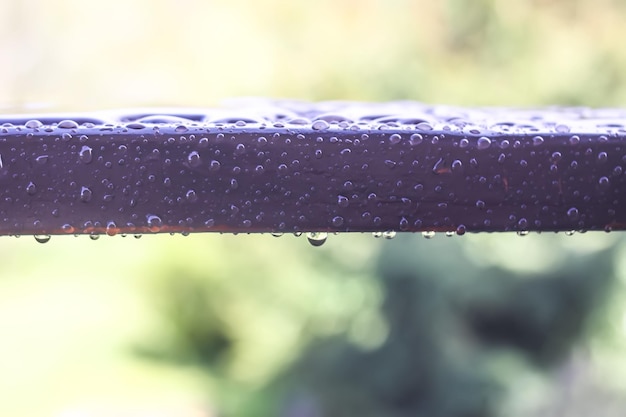 Wet wooden railing of terrace Architecture detail in water drops after the rain