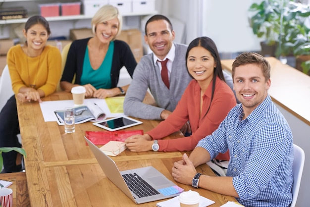 Weve be expecting you Portrait of a group of colleagues sitting around a table