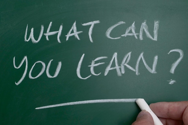 What can you learn text on chalkboard business education concept