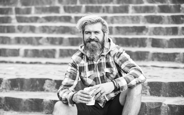 What a great morning hipster relax on stairs mature traveler
having rest take away coffee good morning inspiration brutal man
with beard drinking tea from cup bearded man drink coffee
outdoor