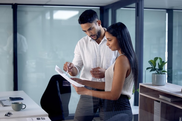 What do you think about it Shot of two work colleagues reading over some documents together