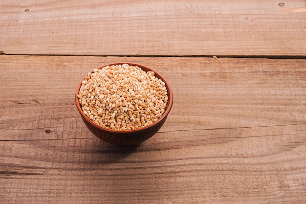 Wheat bowl on wooden table