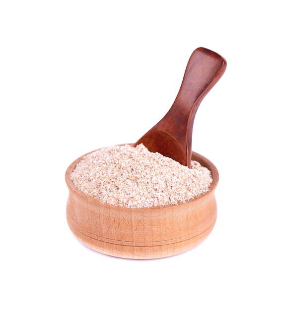 Wheat bran in a small wooden bowl