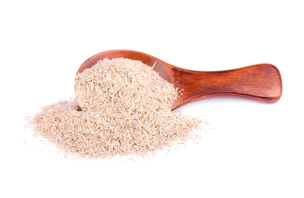 Wheat bran in a small wooden spoon